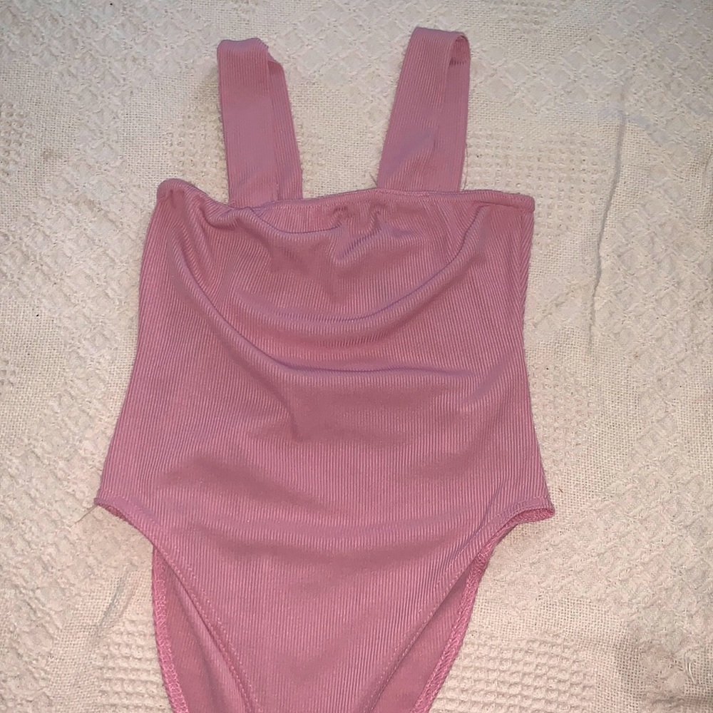 pink body suit